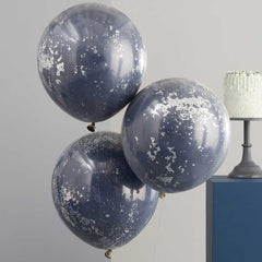 Drie donkerblauwe balonen met zilveren confetti snippers