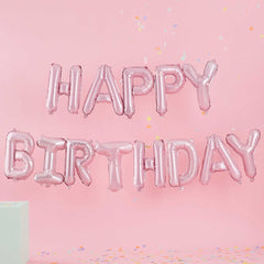 folie ballonnen in de vorm van de woorden happy birthday
