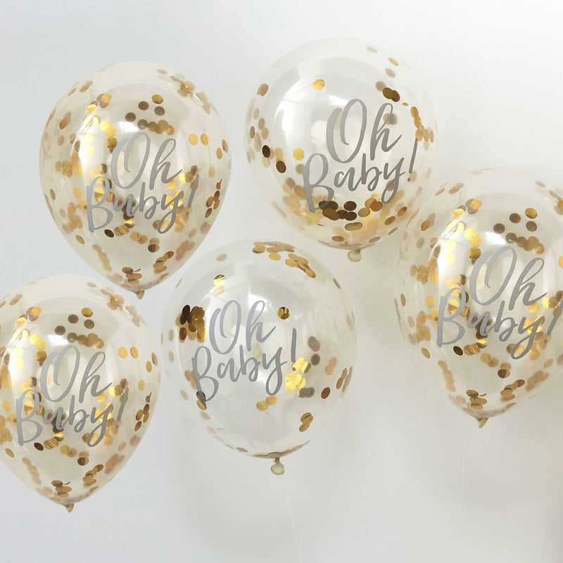 vijf transparante ballonnen met gouden confetti en oh baby erop