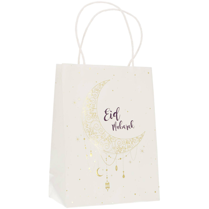 Wit cadeautasje met de tekst eid mubarak en een maan in het donkerblauw en goud