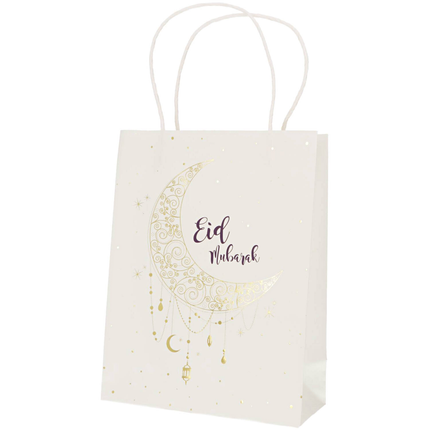 Wit cadeautasje met de tekst eid mubarak en een maan in het donkerblauw en goud