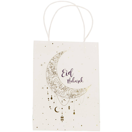 Wit cadeautasje met de tekst eid mubarak en een maan in het donkerblauw en goud
