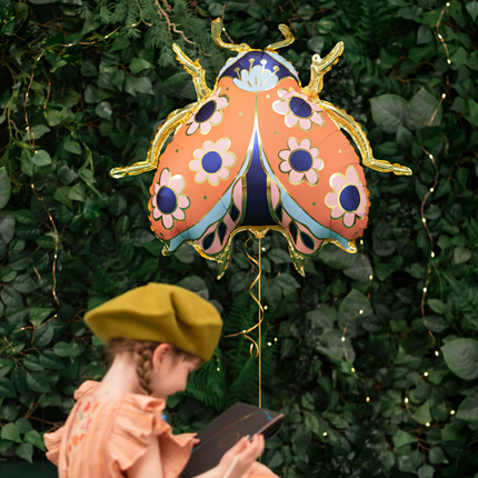 folieballon lieveheersbeestje met gouden poten en bloemen