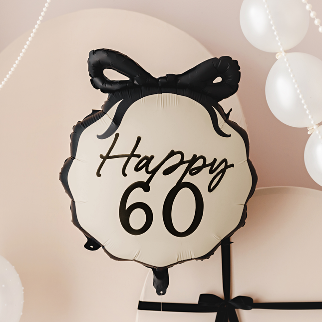 creme ballon met zwarte tekst happy 60 en zwarte strik