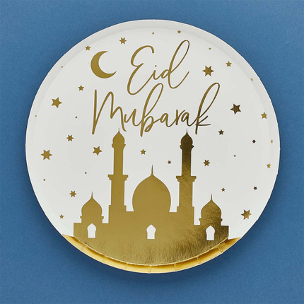 Papieren bordje in het goud en wit met de tekst Eid Mubarak op een blauwe achtergron
