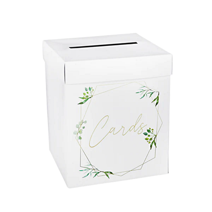 Witte doos met gouden geometrische vormen en de tekst cards versierd met groene blaadjes