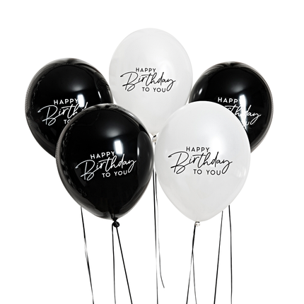 zwarte en witte ballonnen met de tekst happy birthday to you