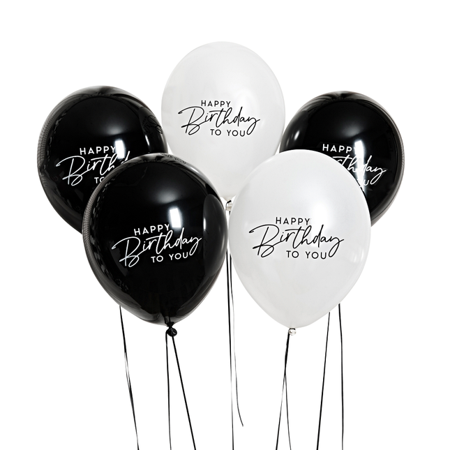 zwarte en witte ballonnen met de tekst happy birthday to you