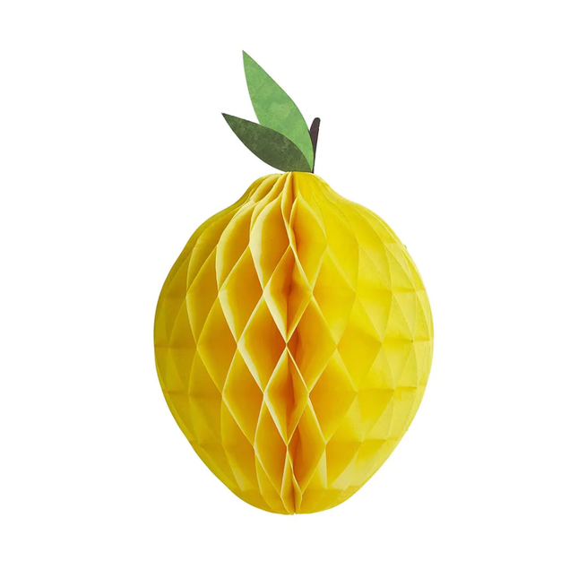 Gele honeycomb in de vorm van een citroen met groene blaadjes