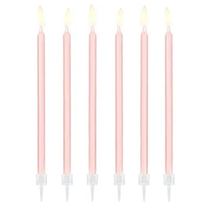 Zes lange roze taartkaarsen