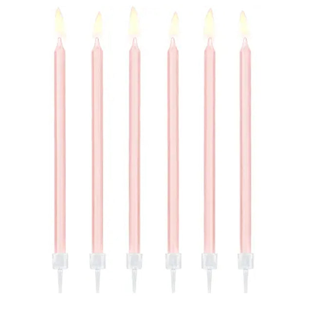 Zes lange roze taartkaarsen