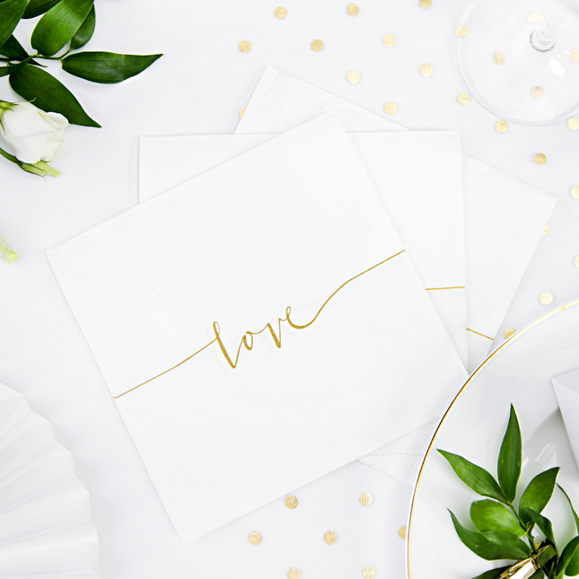 witte servet met gouden tekst love