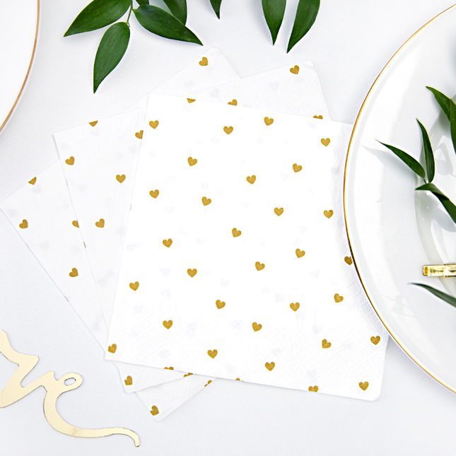 witte servet met gouden hartjes