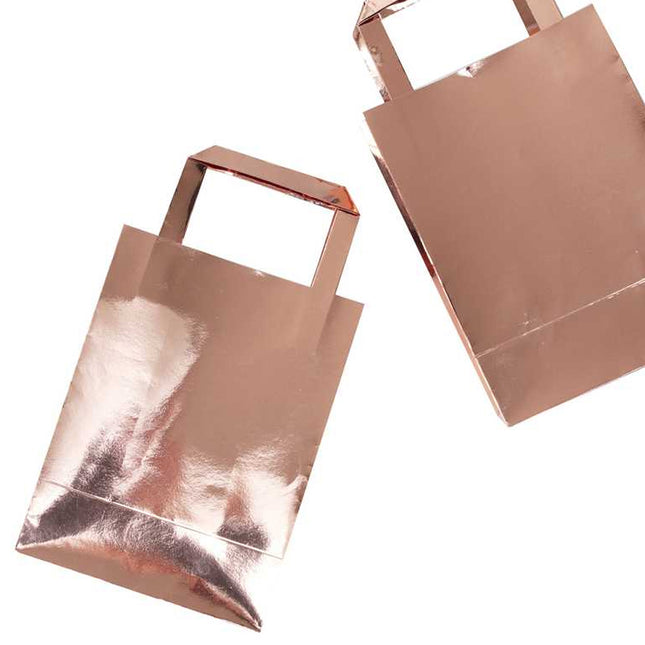 Glanzende rose gouden tasjes