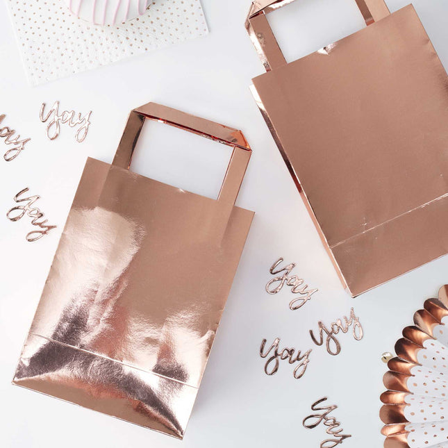 Glanzende rose gouden tasjes